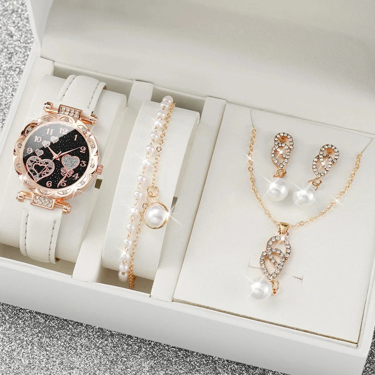 Set of four white quartz watches with diamond accents from Corporación Turística, featuring elegant round faces and silver straps.