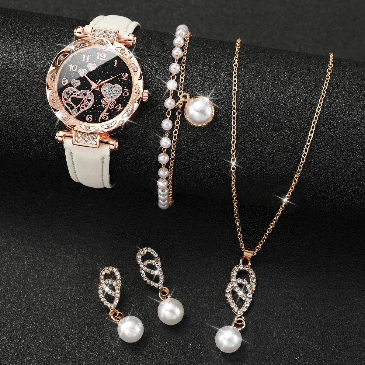 Set of 4 quartz watches with diamond accents by Corporación Turística, featuring sleek white dials and elegant design.