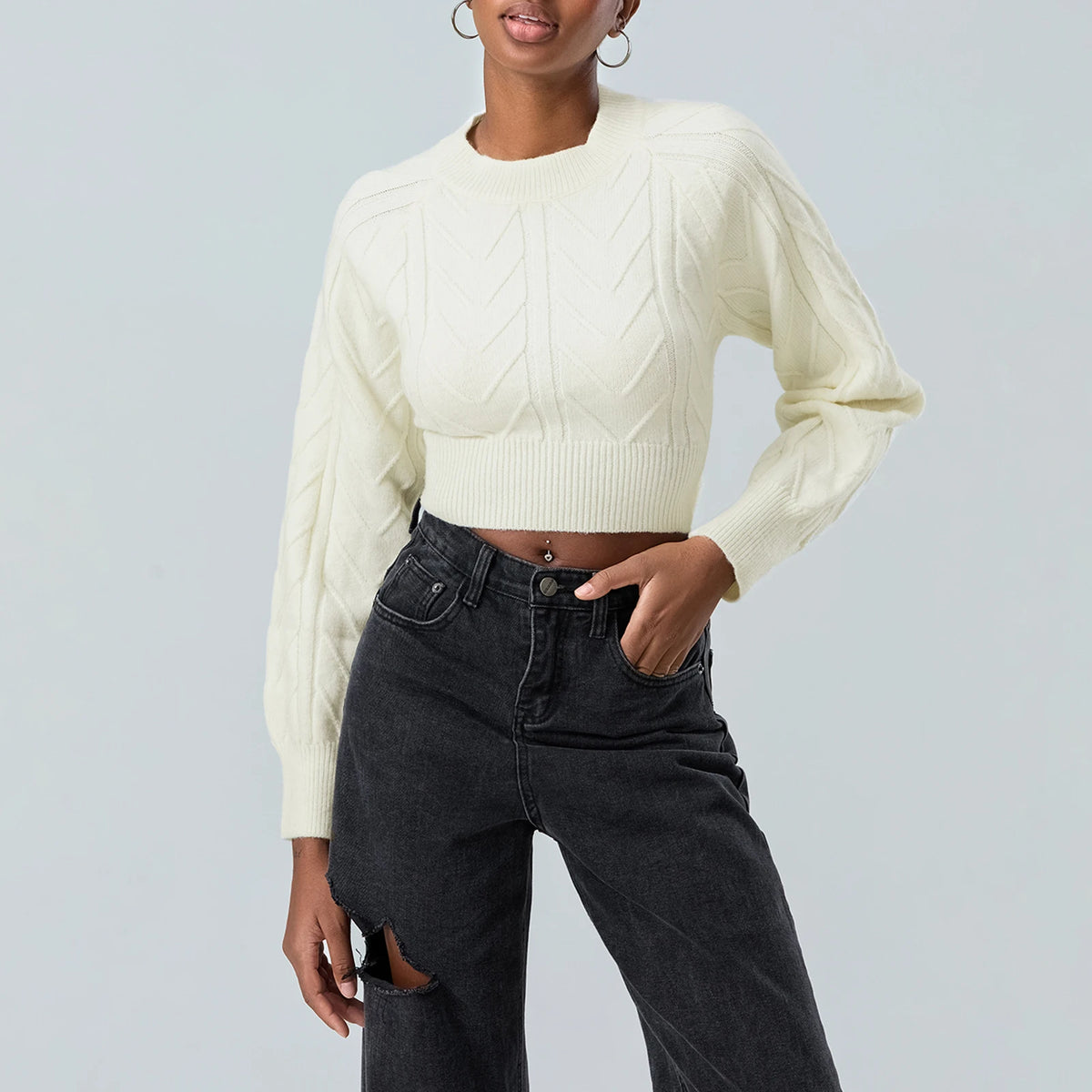 White women's cable-knit sweater from Corporación Turística, featuring a cozy, short-sleeve design with a stylish cable pattern.