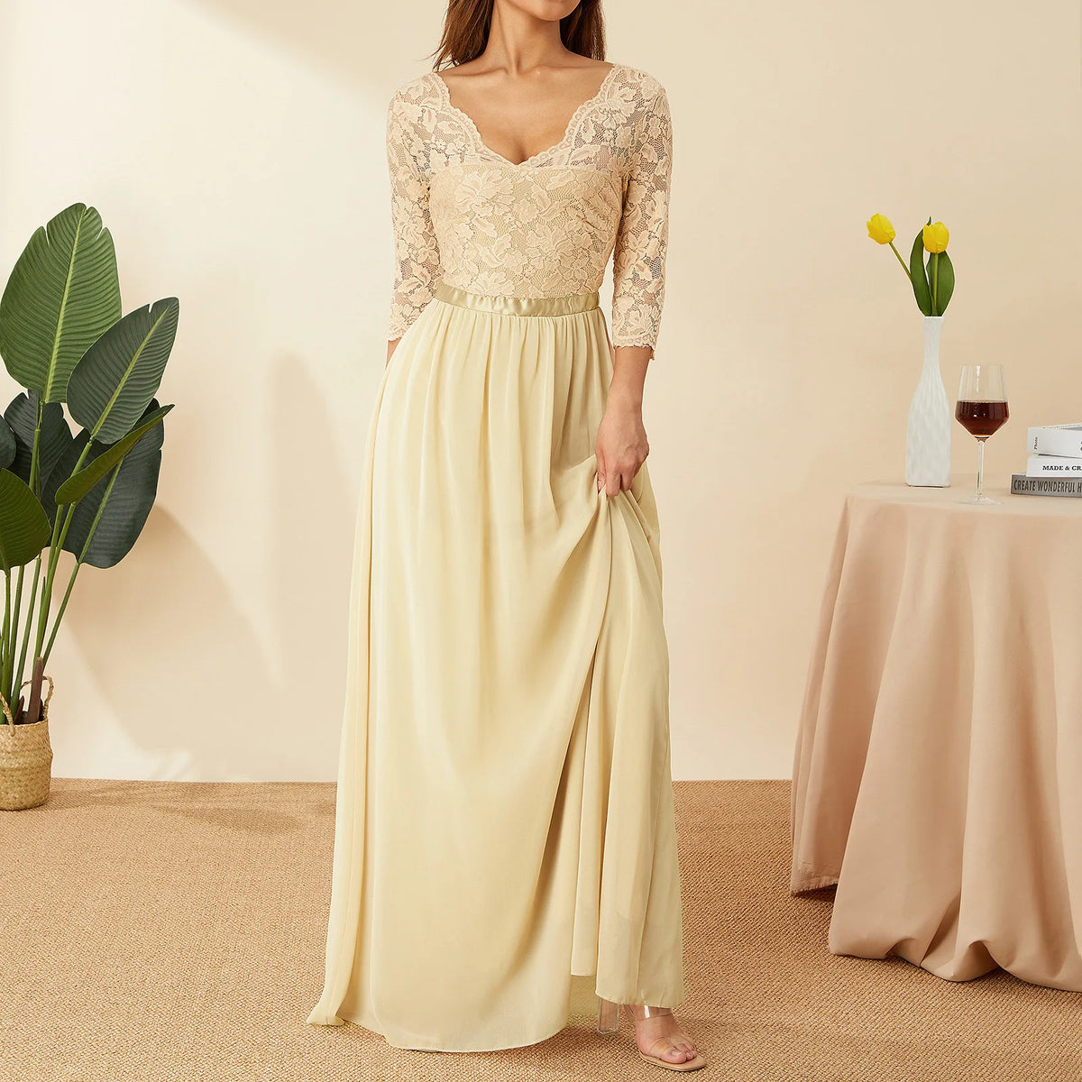 Elegant white lace and chiffon long dress by Corporación Turística, featuring flowing fabric and intricate lace details.