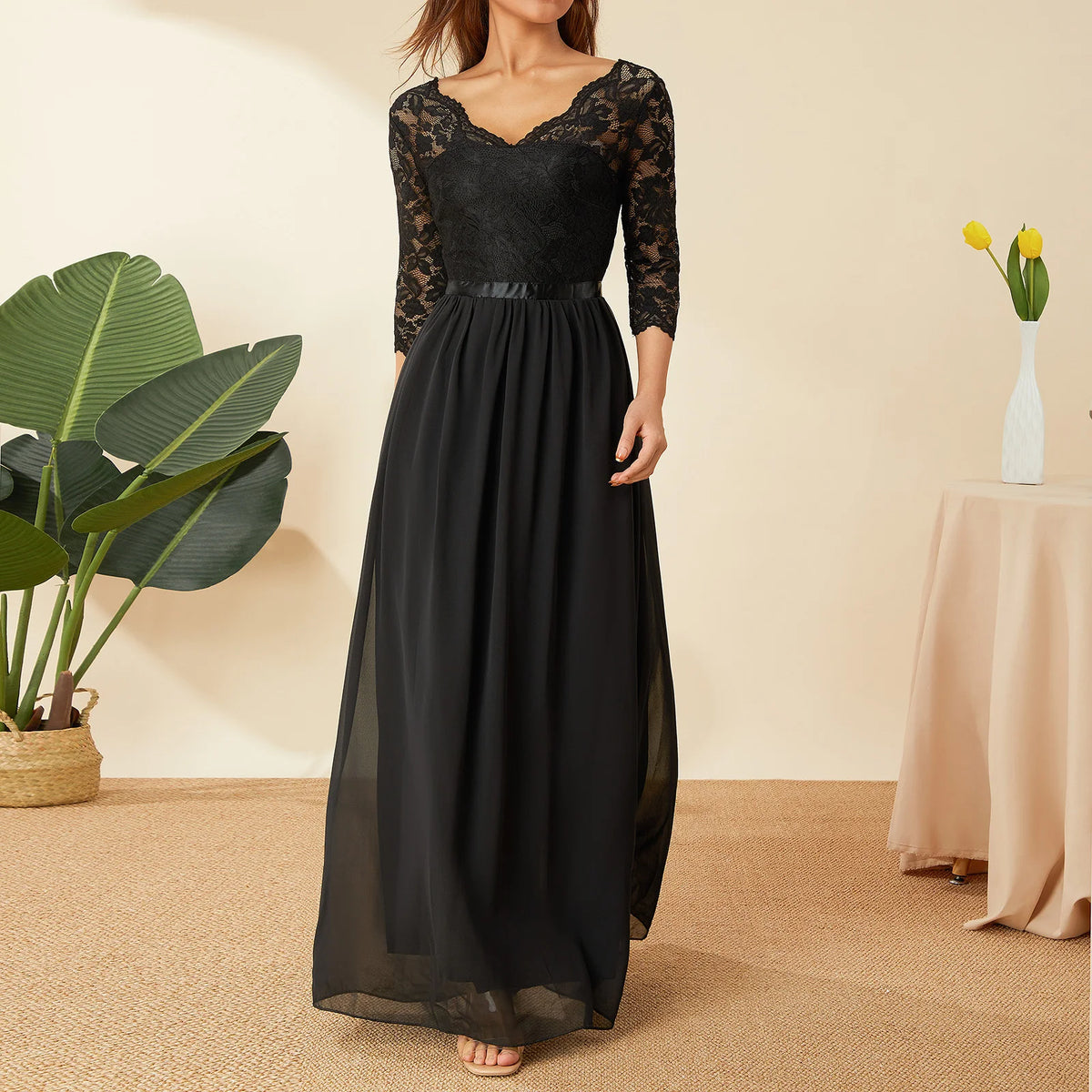 Elegant white long dress with lace and chiffon fabric, featuring a flowing design and intricate detailing, perfect for formal occasions.