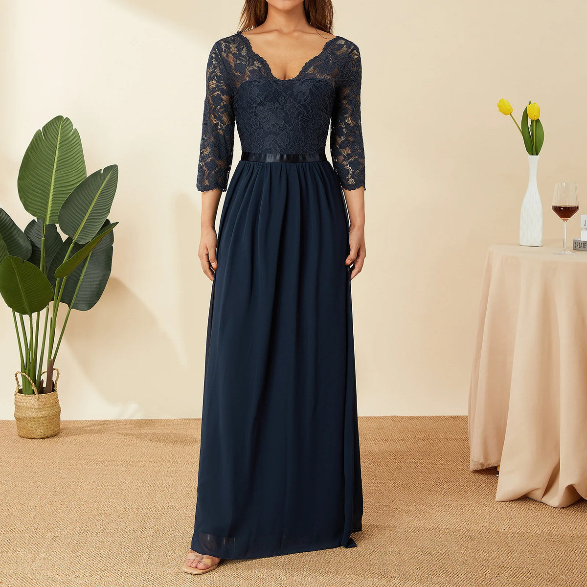 Elegant white long chiffon and lace dress by Corporación Turística, featuring flowing fabric and intricate lace details.