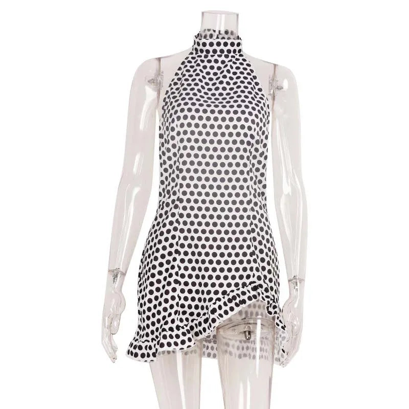 Halter summer dress with polka dot print from Corporación Turística, featuring a sleeveless design in white fabric.
