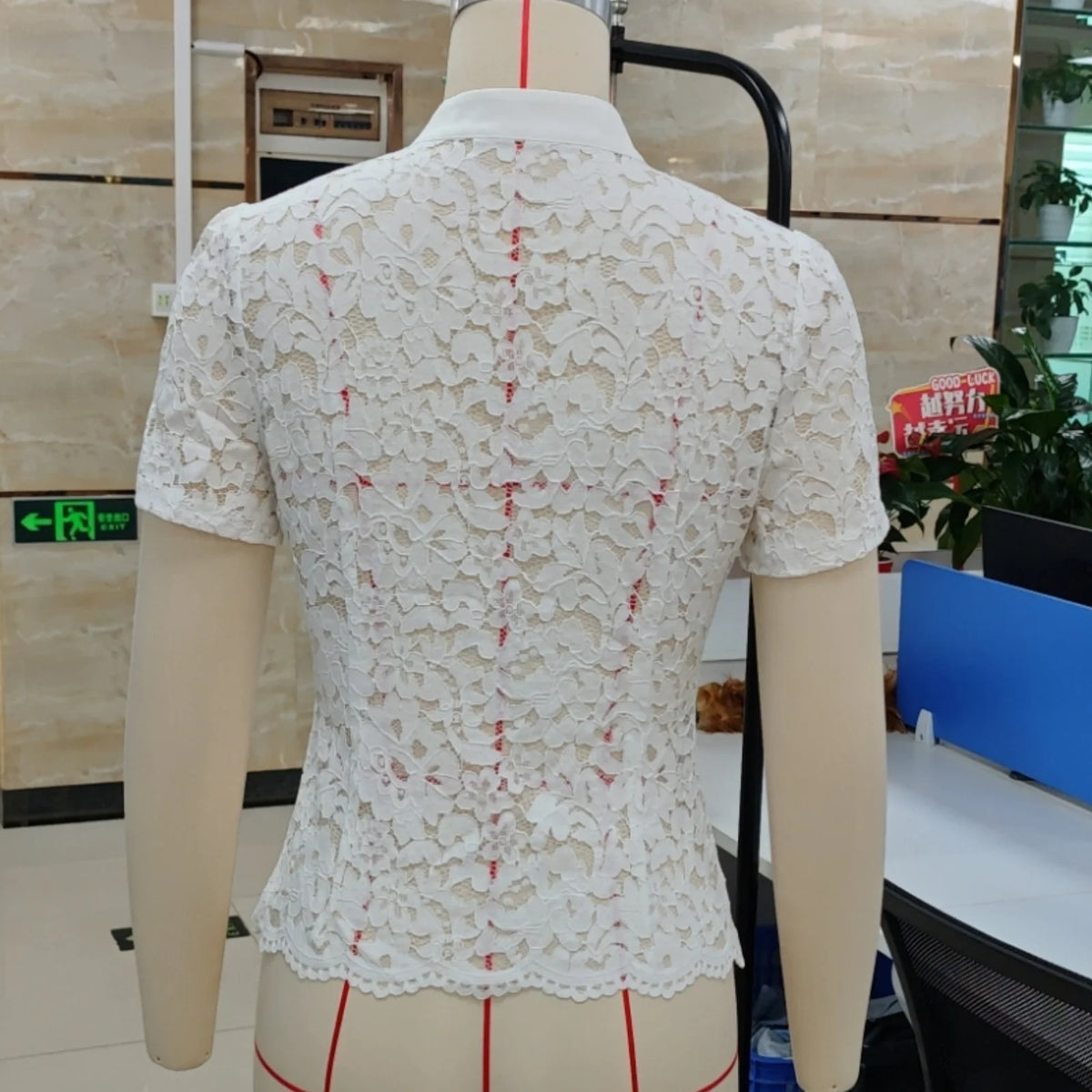 White women's summer short-sleeve shirt with collar from Corporación Turística, casual and breathable for warm weather.