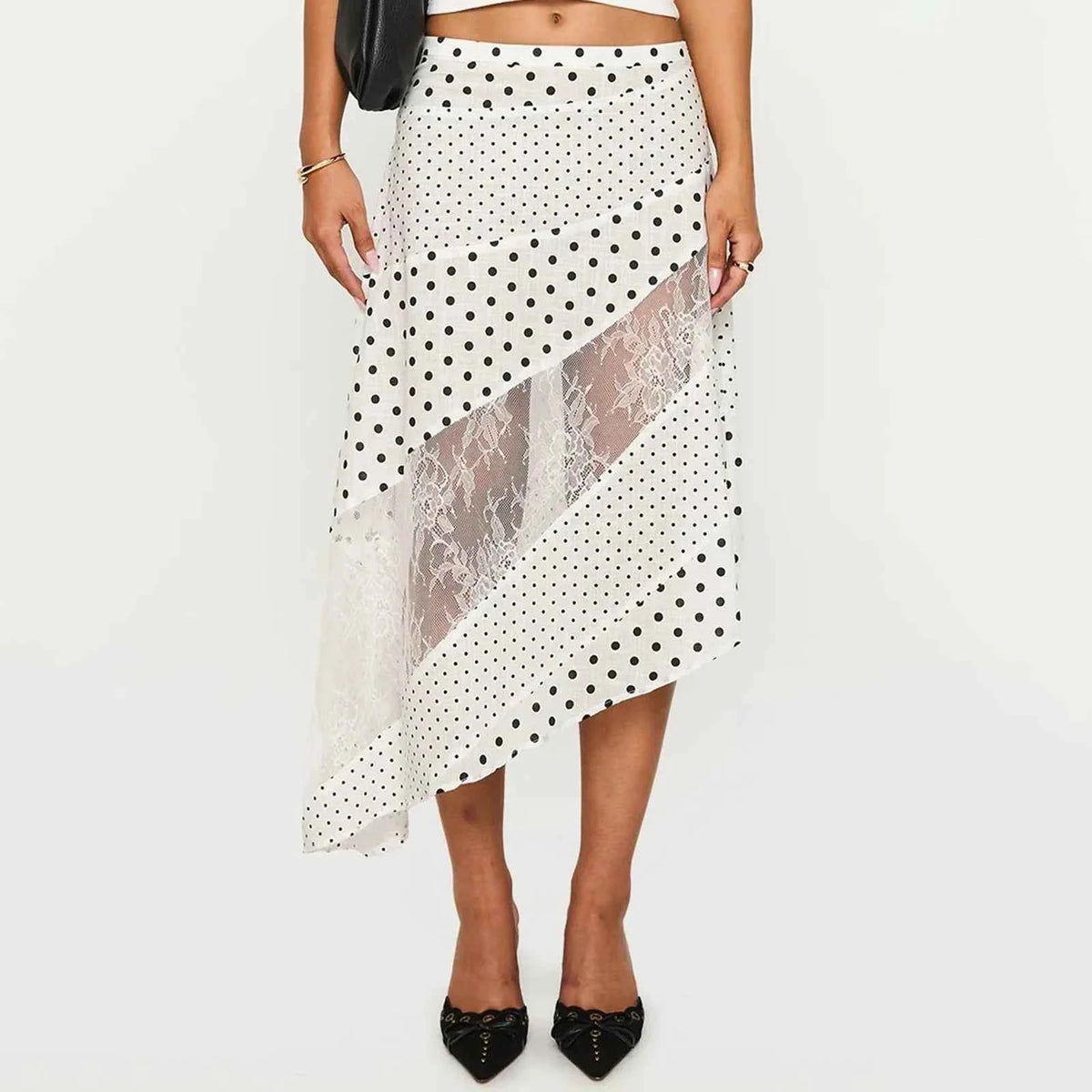 Fluida midi lace skirt for women with irregular hem, white color, from Corporación Turística. Stylish and elegant design.