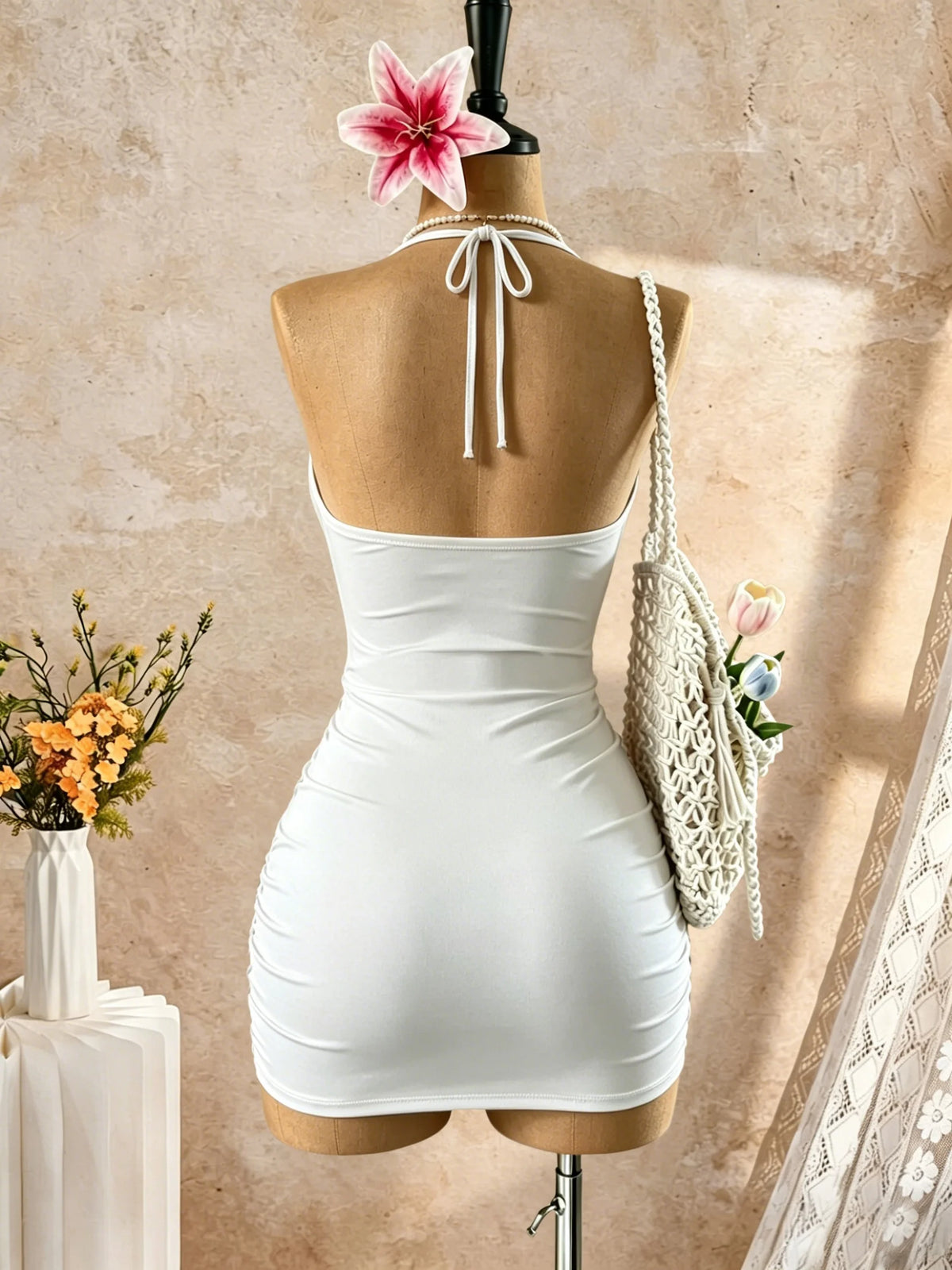 White sleeveless fitted halter neck dress by Corporación Turística, suitable for casual or semi-formal occasions.