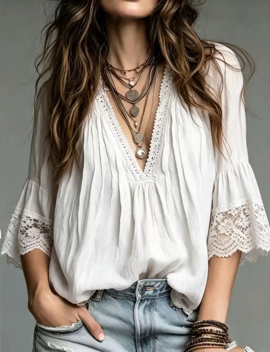 White bohemian blouse with V-neck for women, styled in European fashion, by Corporación Turística.