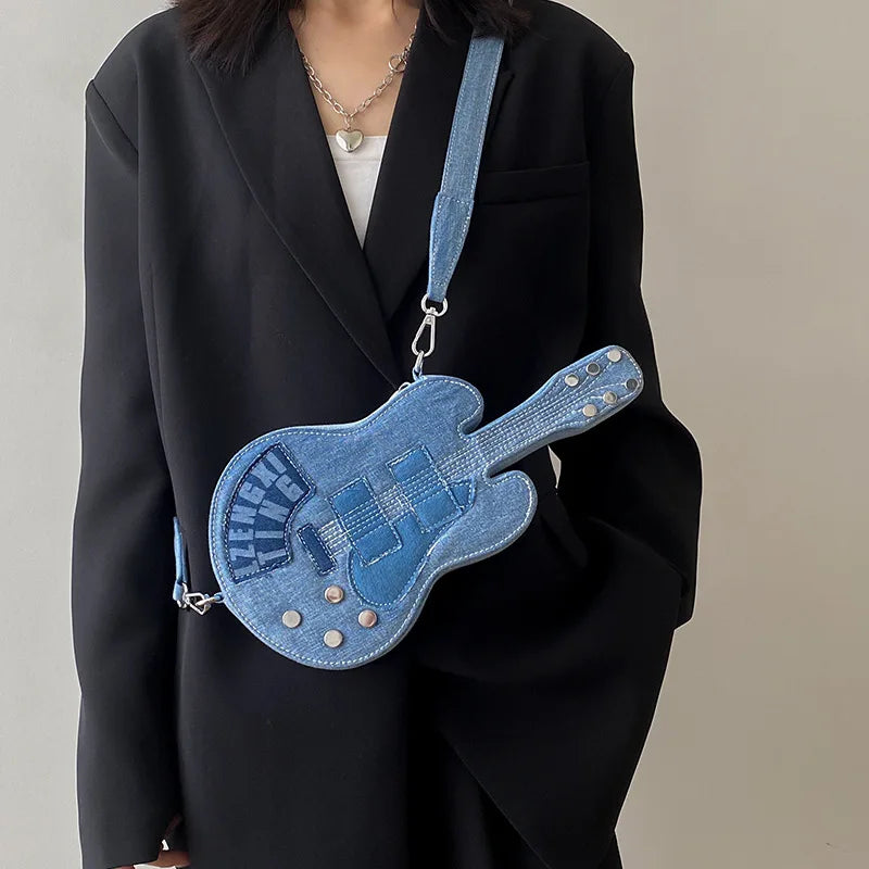 Blue denim crossbody handbag for women from Corporación Turística, featuring a shoulder strap and stylish casual design.