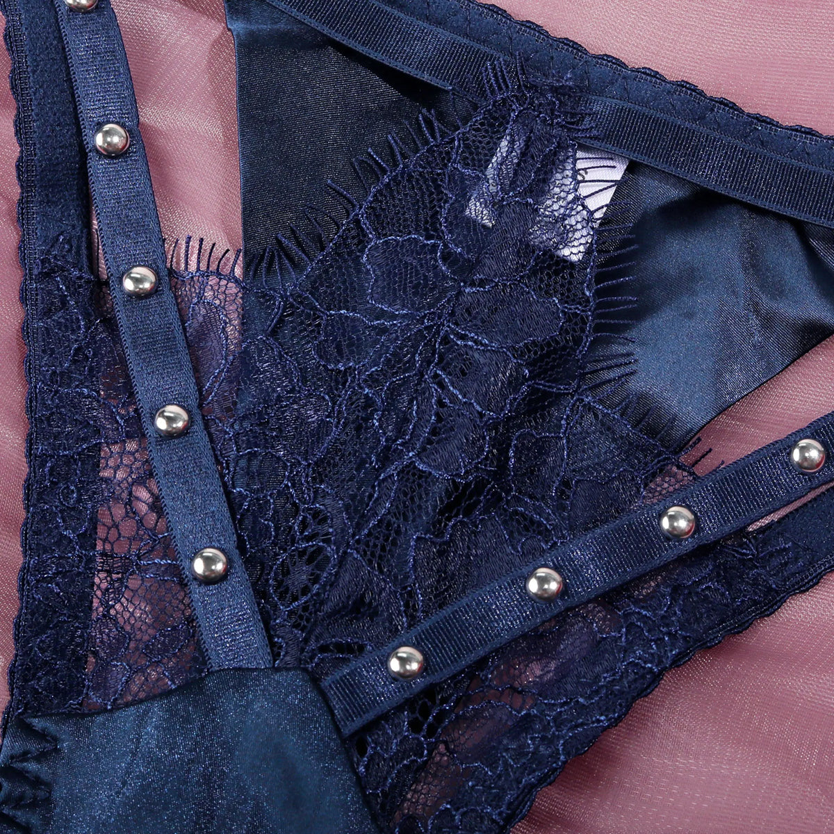 Luxury women's lingerie set featuring a blue lace bra and matching panties from Corporación Turística.