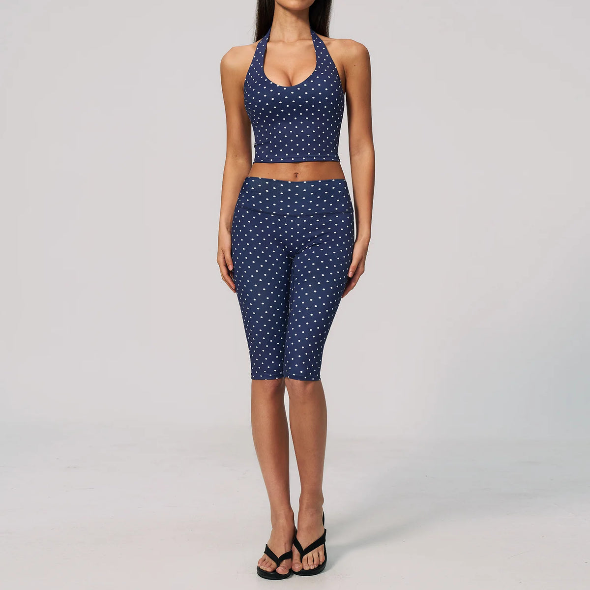 Blue and brown women's 2-piece yoga sports set from Corporación Turística, featuring a fitted top and matching leggings.