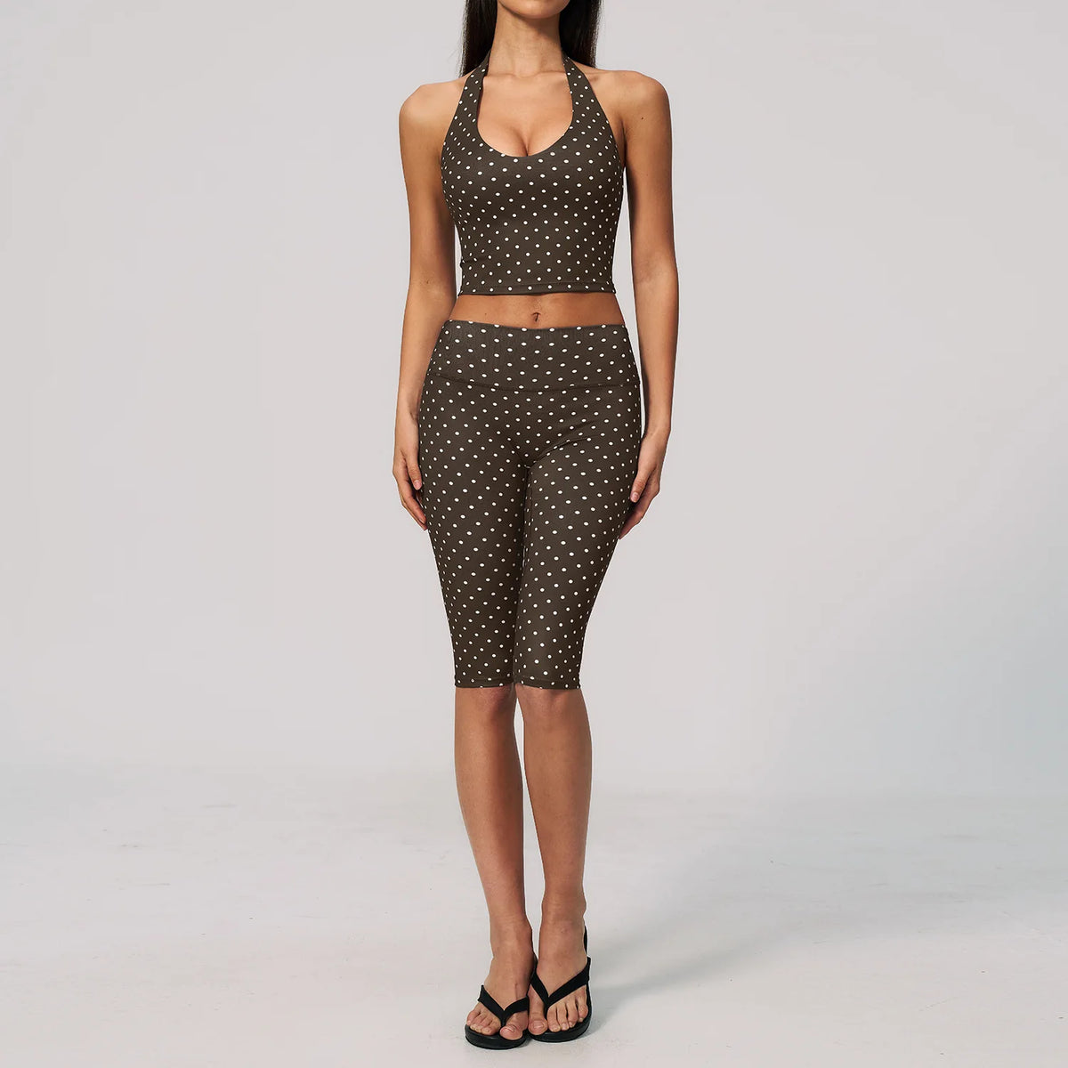Blue and brown 2-piece women's sports set by Corporación Turística, includes a yoga top and leggings, perfect for active wear.