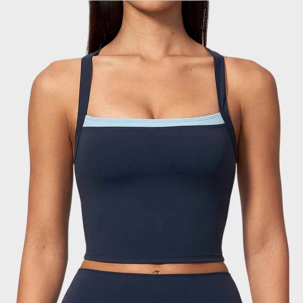 Blue women's sports bra by Corporación Turística, two-piece design, comfortable fit, ideal for active wear and workouts.