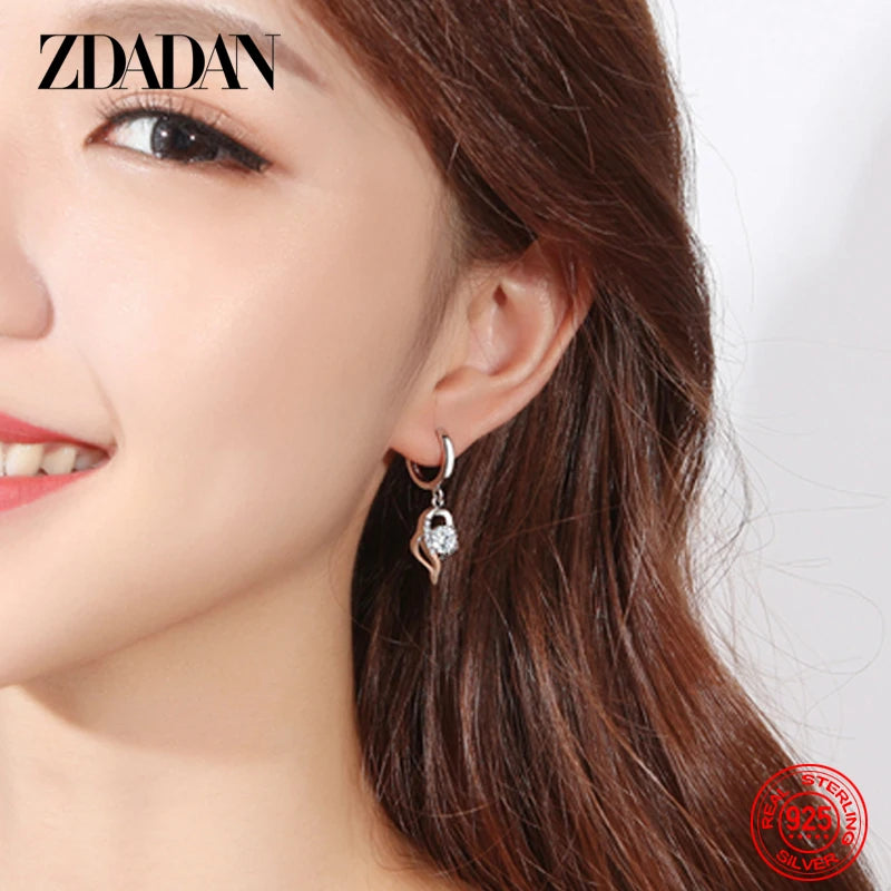 Blue zircon crystal earrings for women by Corporación Turística, showcasing elegant dangling jewelry with sparkling stones.