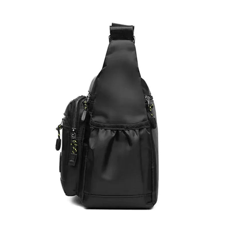 Black nylon men's crossbody bag with multiple layers, ideal for business travel, from Corporación Turística.