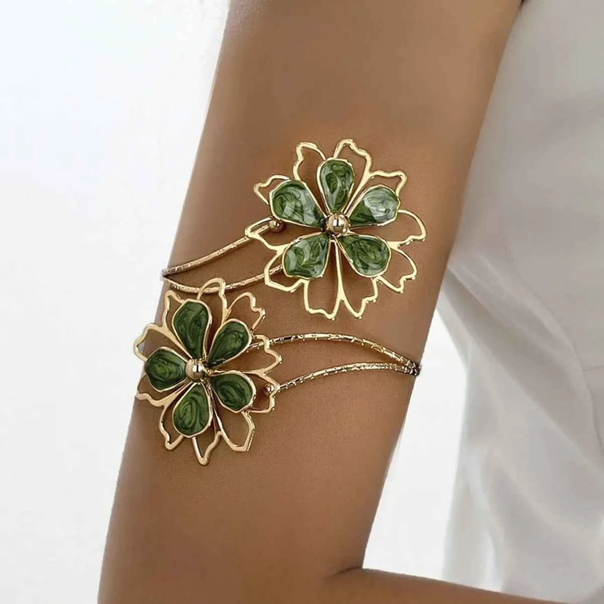 Open colorful floral bracelet with hollow flower designs, crafted by Corporación Turística, featuring vibrant multicolored accents.