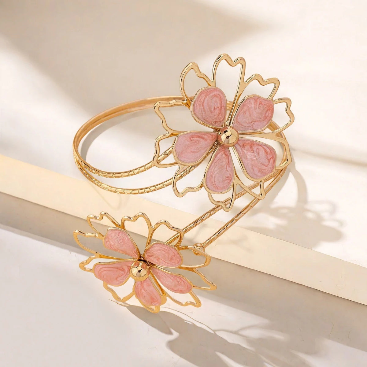 Open multicolored flower bracelet by Corporación Turística featuring hollow floral designs on a vibrant bracelet.