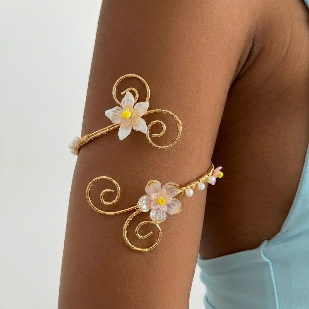 Open multicolored floral bracelet by Corporación Turística featuring hollow flower designs and vibrant colors.