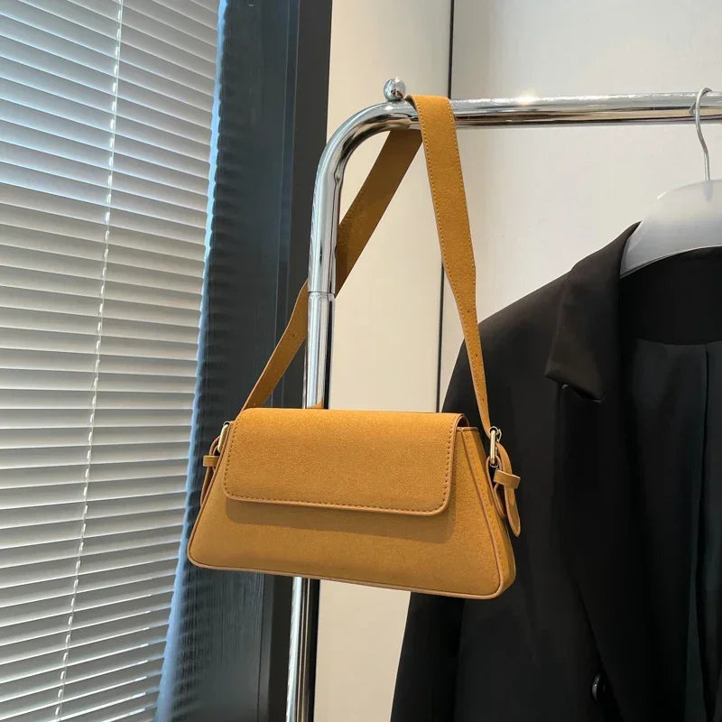 Luxury purple single-shoulder handbags for women by Corporación Turística, featuring elegant design and small size.