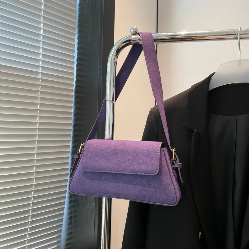 Luxury purple single-shoulder handbag for women by Corporación Turística, with a sleek design and 30cm size.