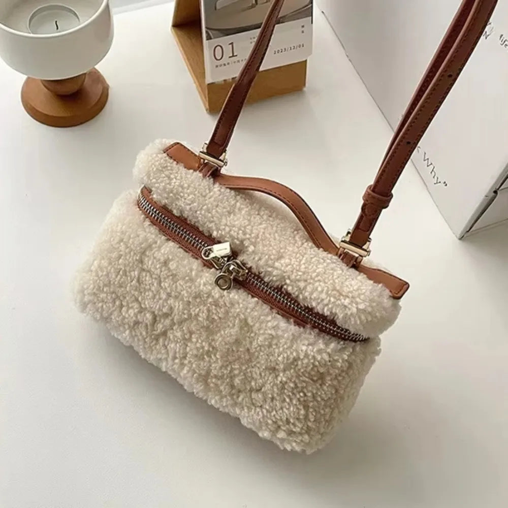 Brown fashion velvet leather shoulder bag with sleek design, crafted by Corporación Turística, featuring elegant detailing.