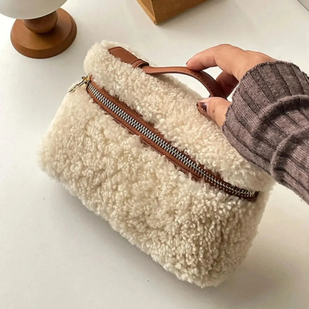 Brown velvet leather clutch bag by Corporación Turística, stylish handheld purse with soft texture and elegant design.