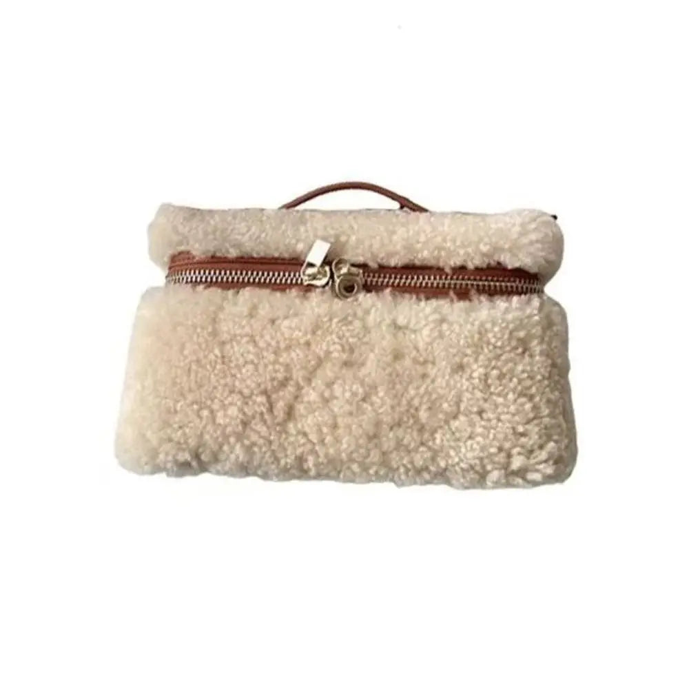 Brown fashionable leather lambskin velvet clutch bag by Corporación Turística, with a soft velvet texture and sleek design.