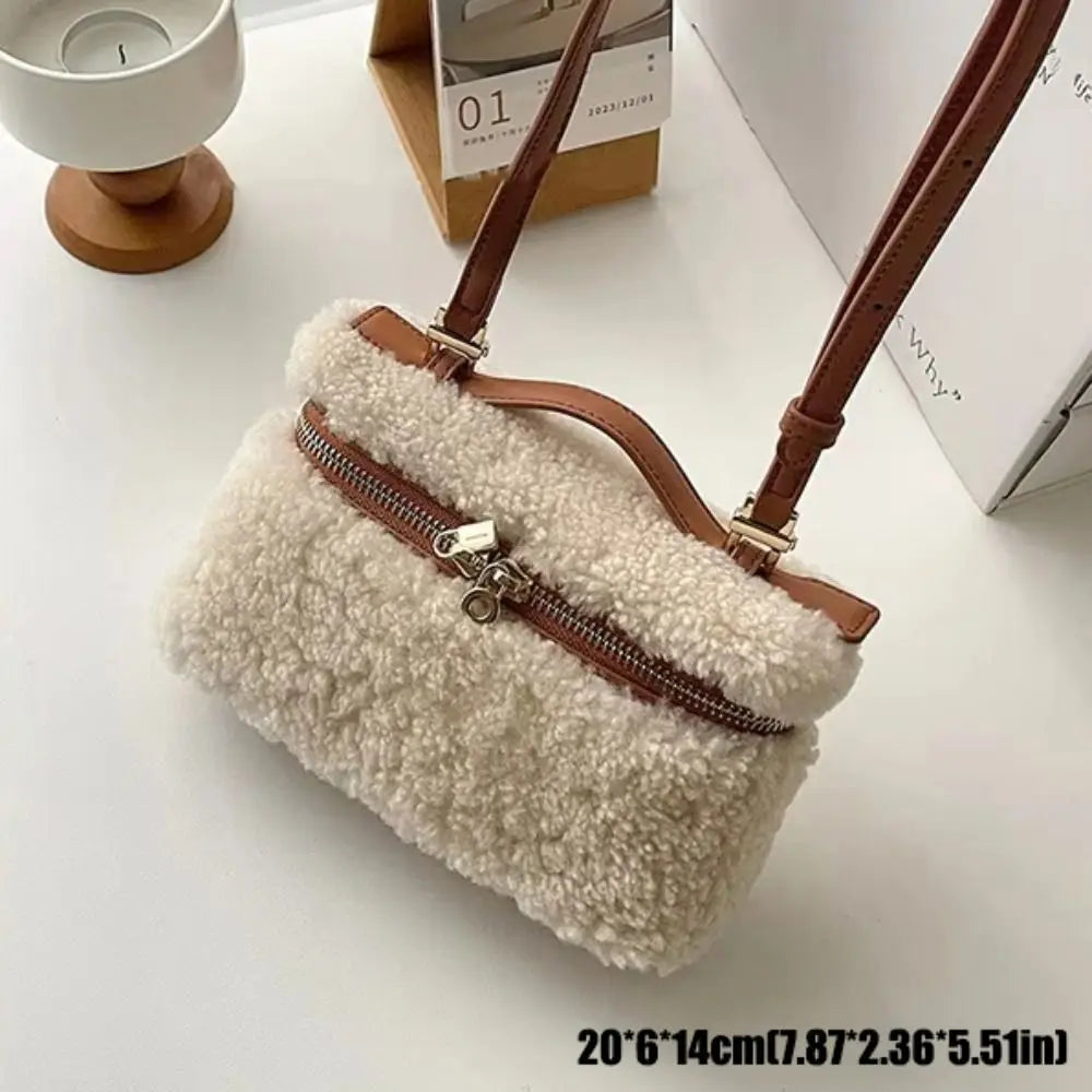 Fashionable brown lambskin velvet clutch bag with sleek design, featuring a soft texture and elegant style from Corporación Turística.