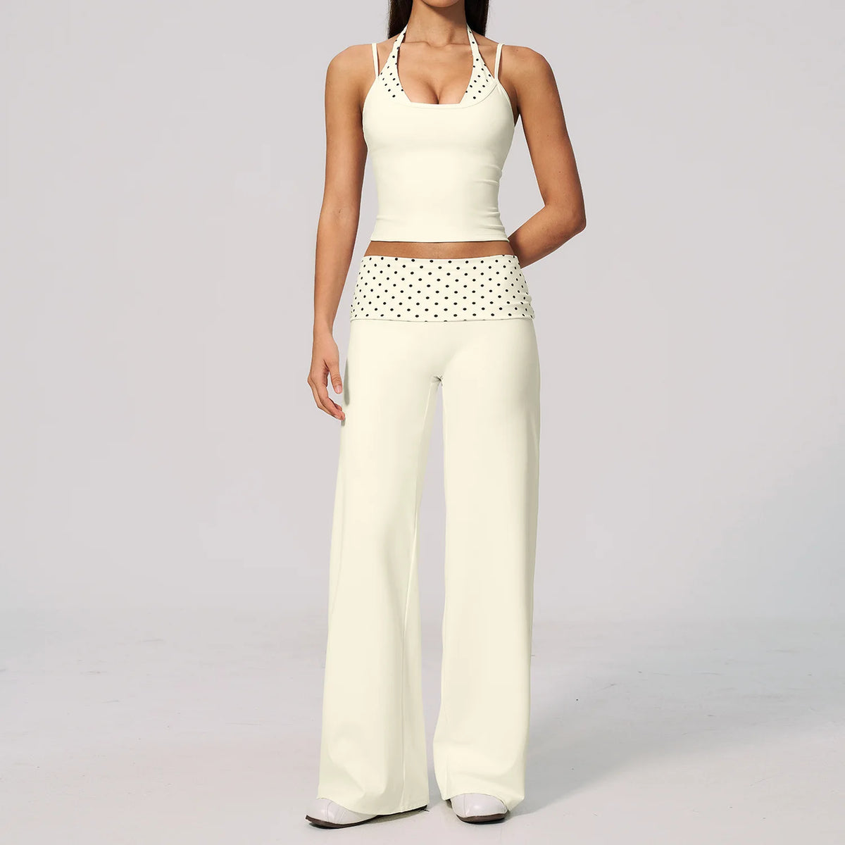 Brown yoga set of 2 pieces from Corporación Turística, including a sports top and leggings, with dotted pattern.
