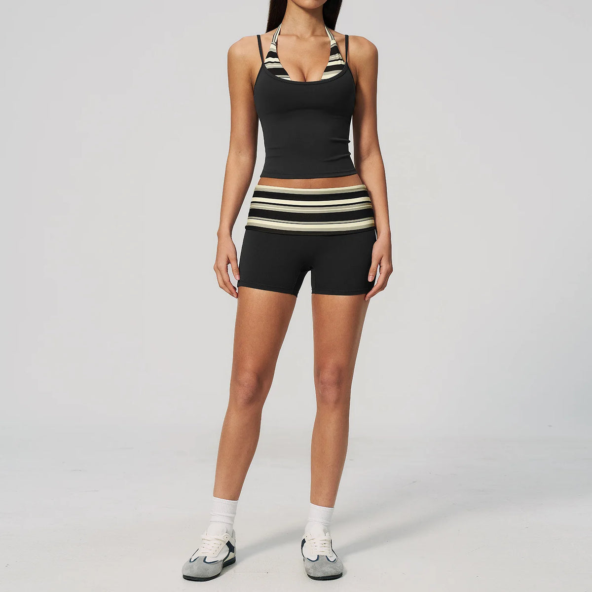 Brown dotted 2-piece yoga set for women by Corporación Turística, including a sports top and matching leggings.