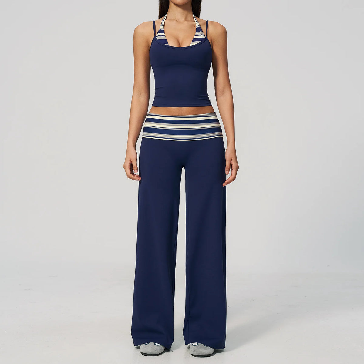 Brown dotted 2-piece yoga set for women by Corporación Turística, includes leggings and a sports top, suitable for active wear.