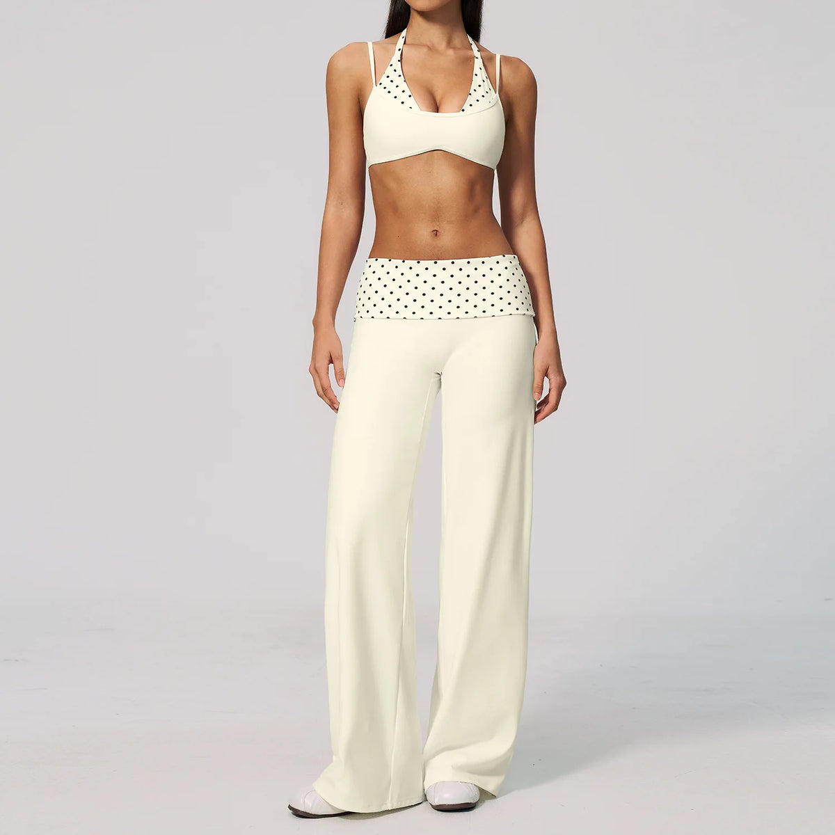 Brown dotted 2-piece yoga set for women by Corporación Turística, includes a sports top and leggings, suitable for active wear.