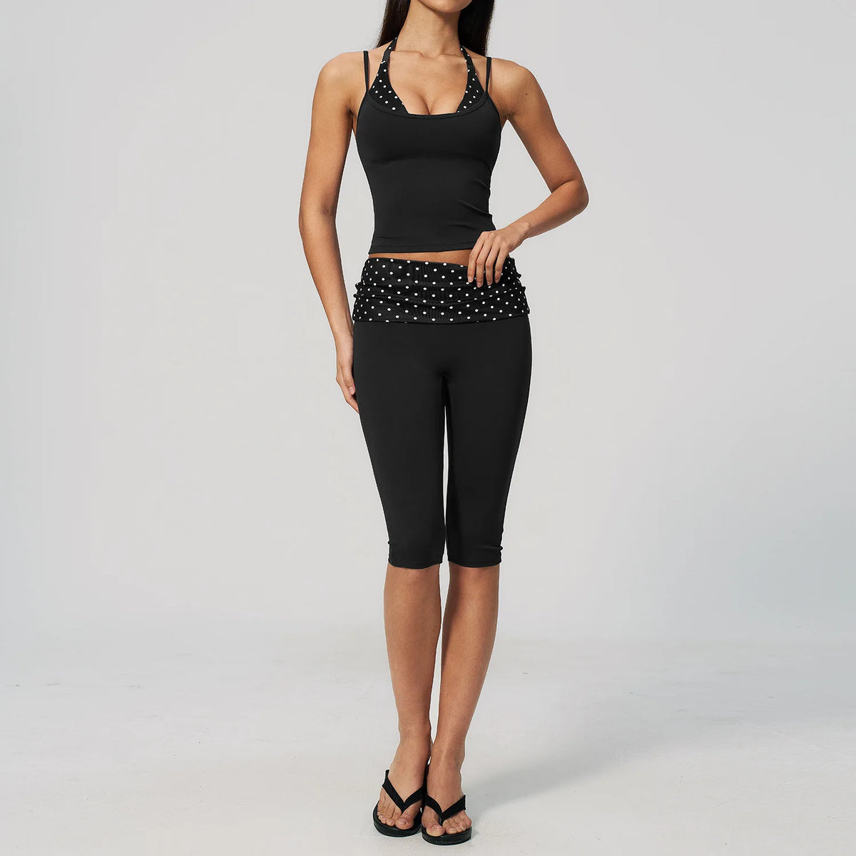 Brown polka dot 2-piece yoga set for women by Corporación Turística, including a sports top and leggings, stretchy and comfortable.
