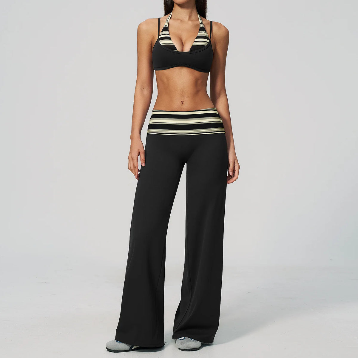 Brown dotted 2-piece yoga set for women, featuring a sports top and leggings from Corporación Turística.