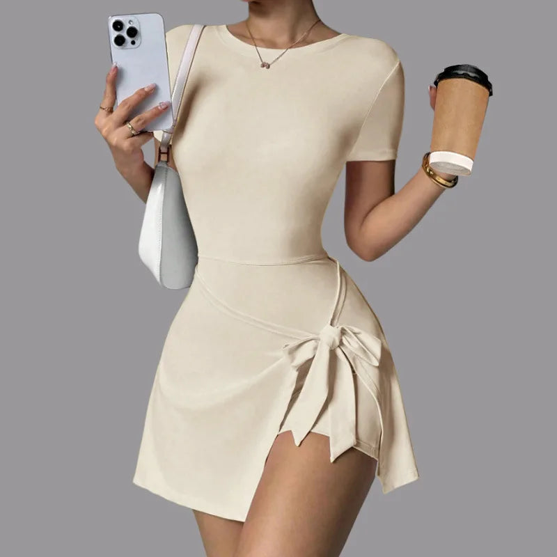 Women's tennis dress by Corporación Turística, two-piece design in brown with a stylish back detail.