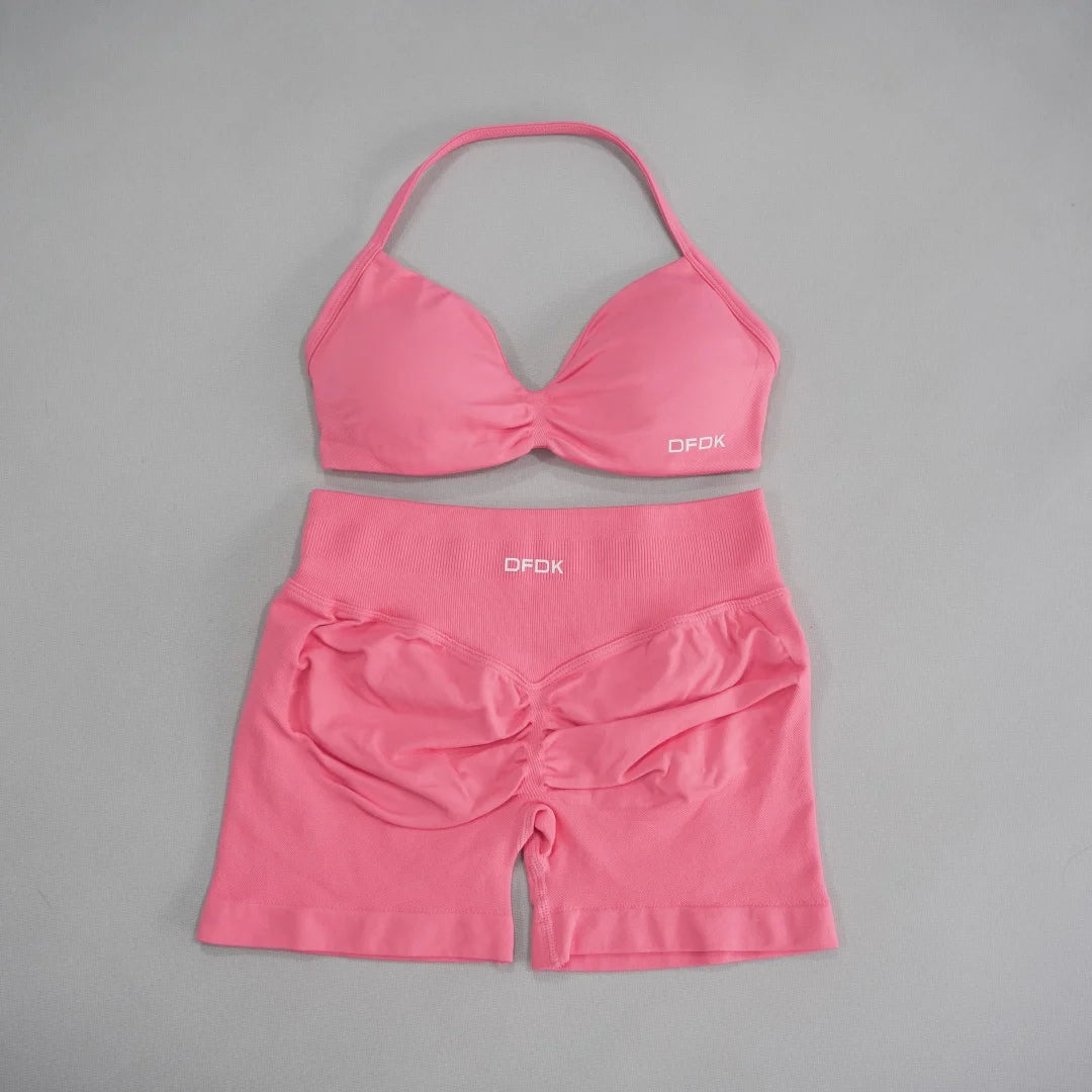Brown women's 2-piece sports set with bra and leggings from Corporación Turística, designed for active wear and comfort.