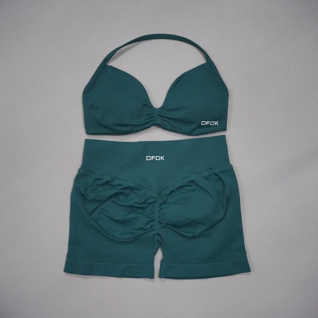 Brown women's 2-piece sports set by Corporación Turística, includes a sports bra and matching workout bottoms.