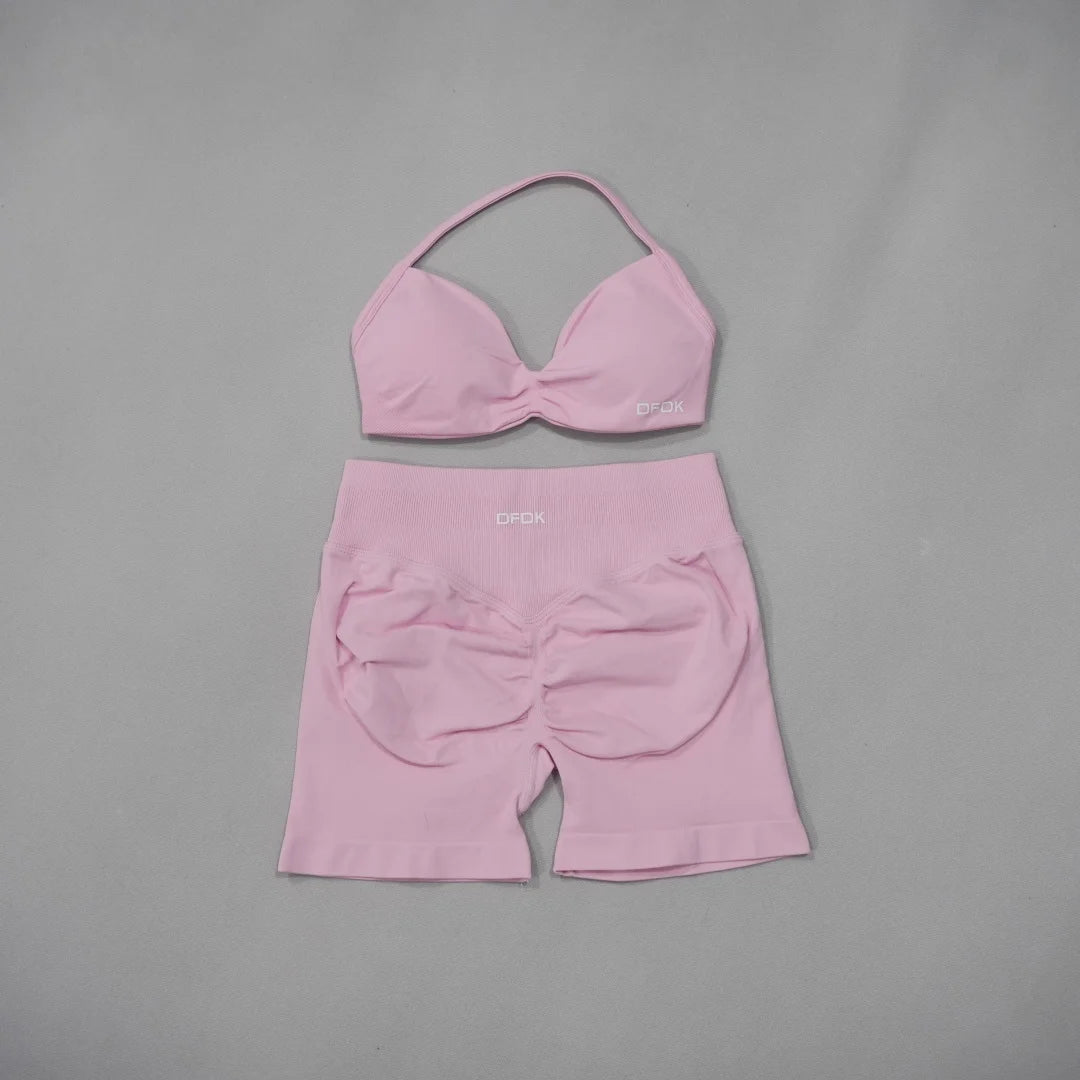 Brown women's 2-piece sports set with sports bra and leggings by Corporación Turística, designed for active wear and comfort.