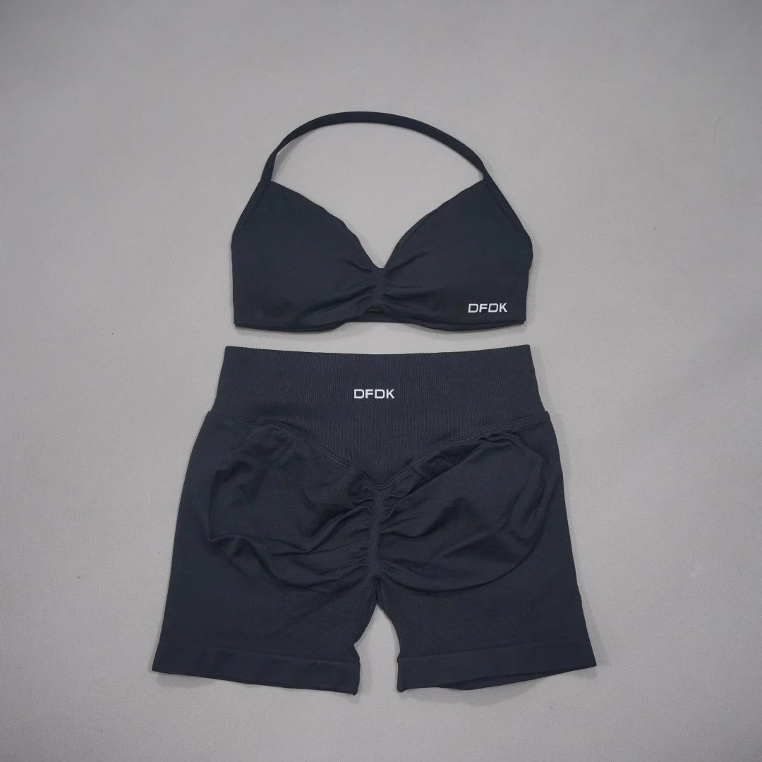 Brown women's 2-piece sports set by Corporación Turística featuring a DFDK sports bra and matching leggings for active wear.