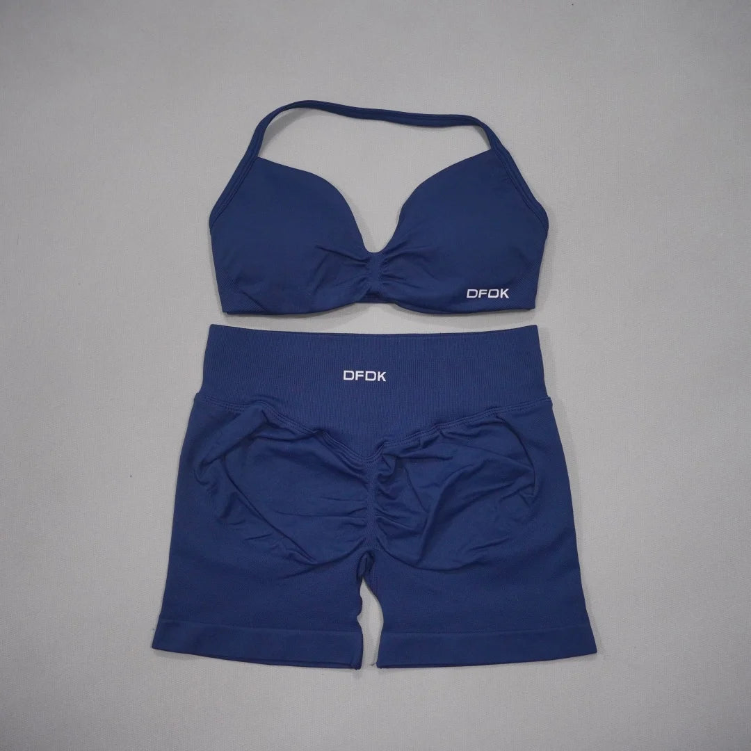 Brown women's 2-piece sports set with sports bra and shorts from Corporación Turística, ideal for active wear and workouts.