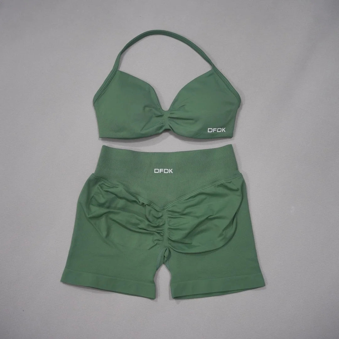 Two-piece women's sports set by DFDK, including a brown sports bra and matching leggings, designed for active wear.