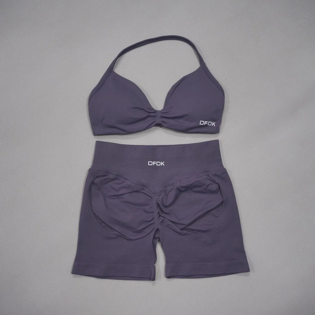 Brown women's 2-piece sports set by DFDK featuring a supportive sports bra and matching athletic shorts.