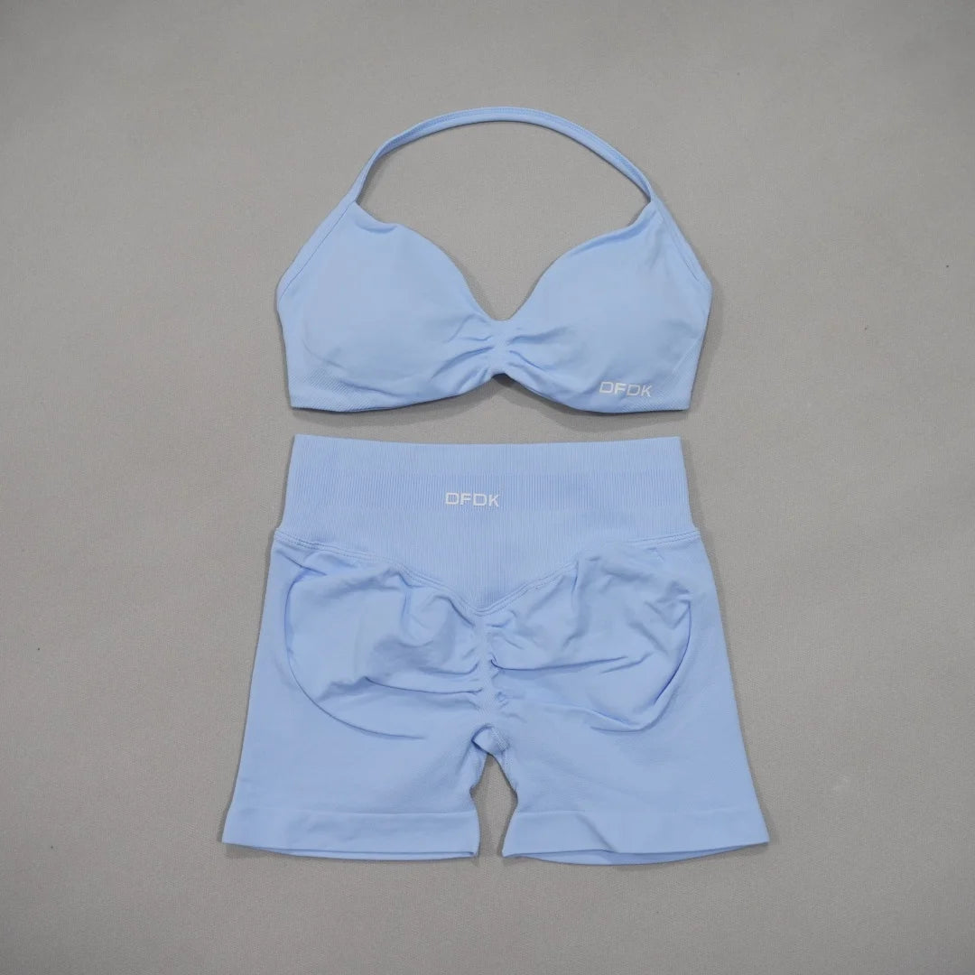 Brown women's DFDK two-piece sports set with sports bra and matching leggings, designed for active wear.