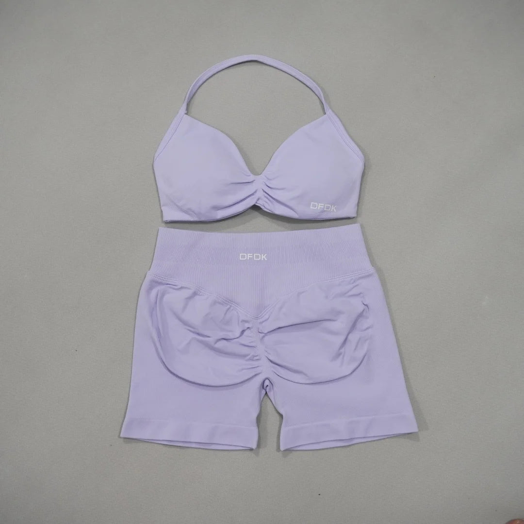 Brown two-piece women's sports set by DFDK, includes sports bra and leggings, made by Corporación Turística.