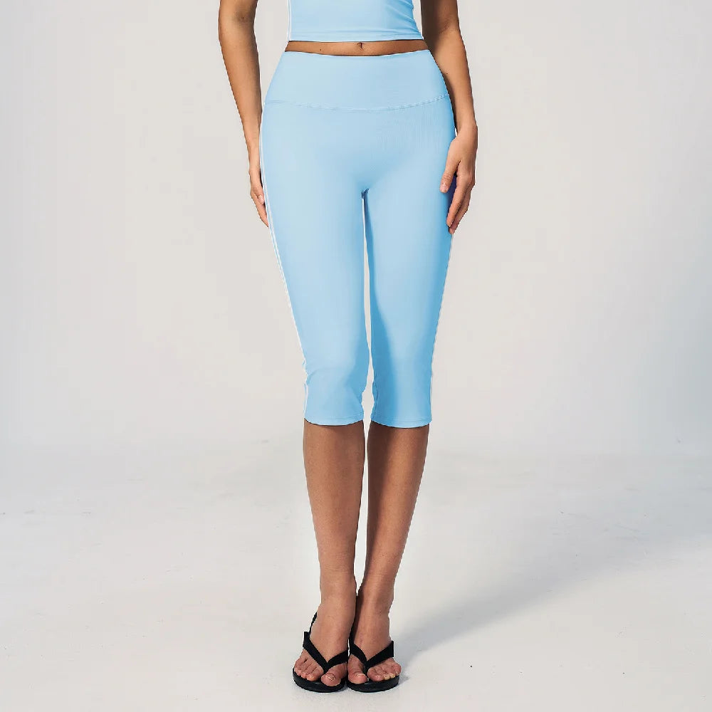 High-waisted women's sports shorts by Corporación Turística, in burnt coffee color, designed for cycling and active wear.