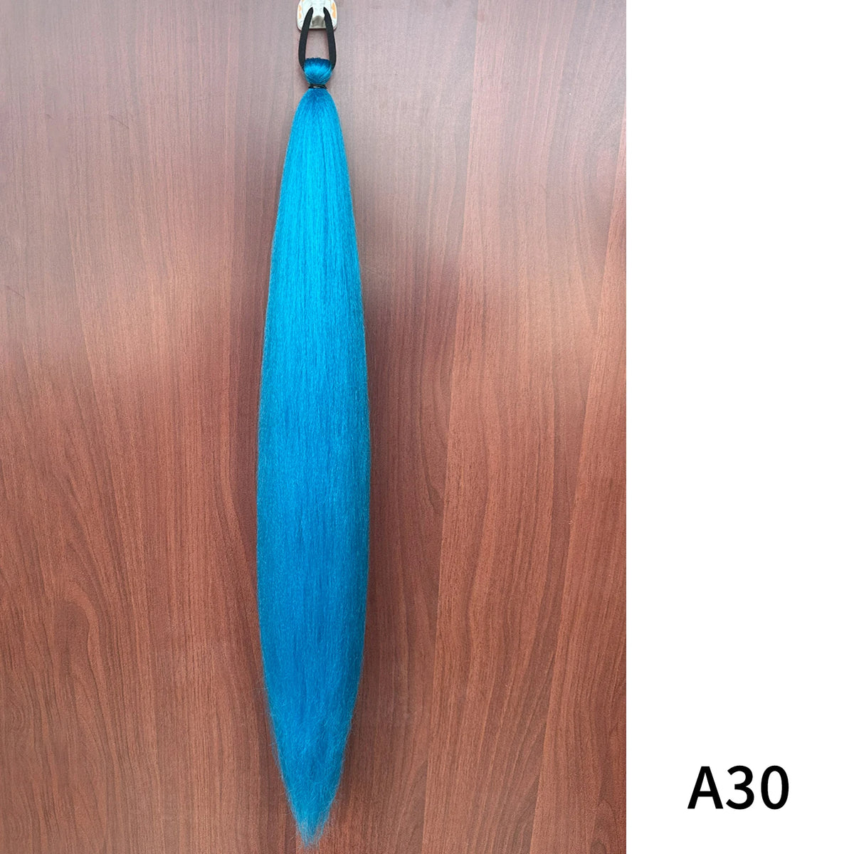 Synthetic purple ponytail extension with band from Corporación Turística, 26-28 inches long, showcasing vibrant hair and secure band.