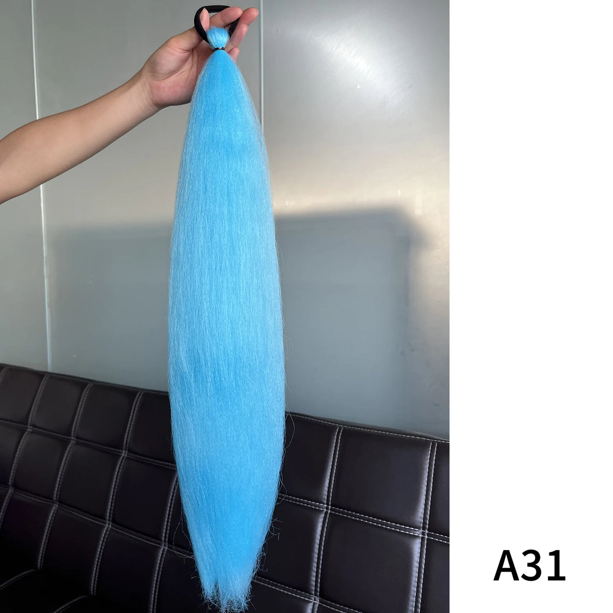 Purple synthetic ponytail extension with band, 26-28 inches, by Corporación Turística, showing the length and vibrant color.