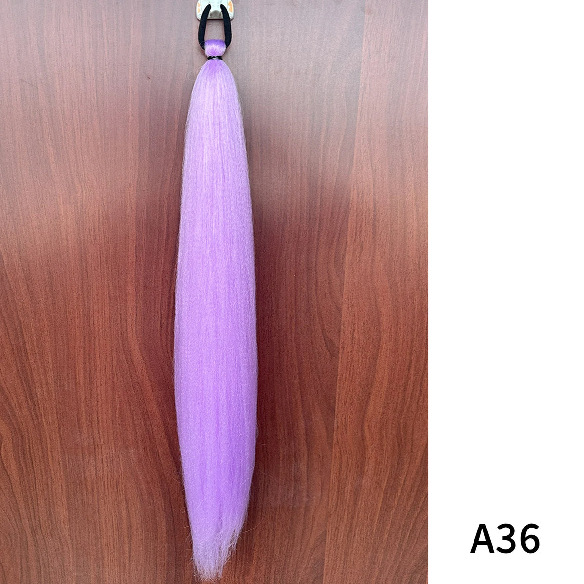 Synthetic purple ponytail extension with band from Corporación Turística, 26-28 inches long, showcasing vibrant hair strands and secure fit.