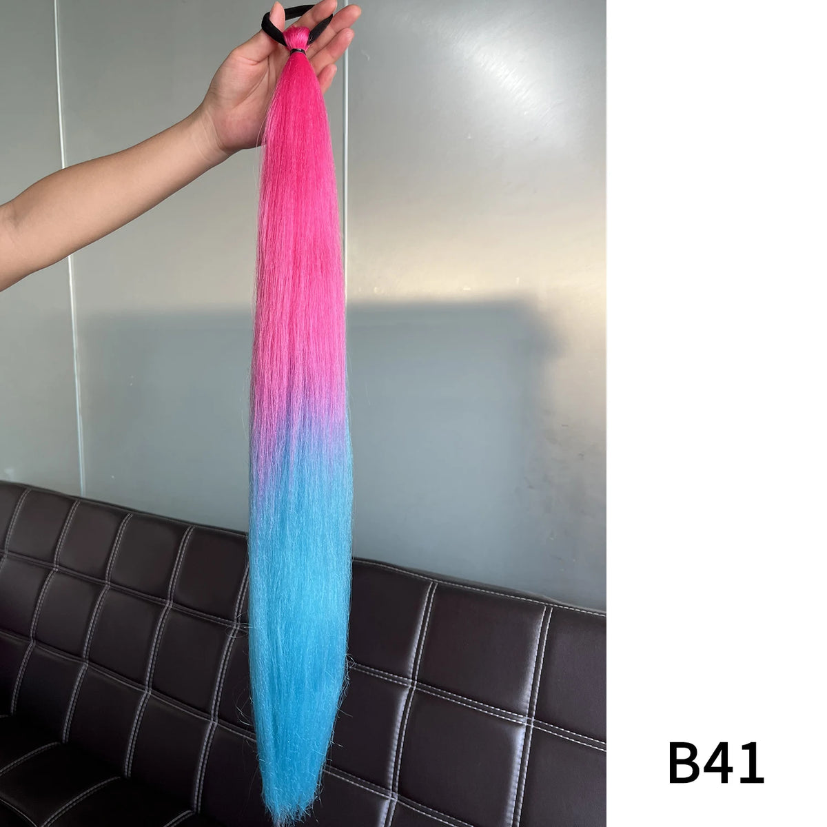 Purple synthetic ponytail extension with band, 26-28 inches long, by Corporación Turística, styled for easy hair enhancement.