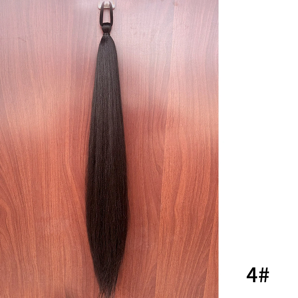 Synthetic purple ponytail extension with band, 26-28 inches long, by Corporación Turística, styled for easy hair enhancement.