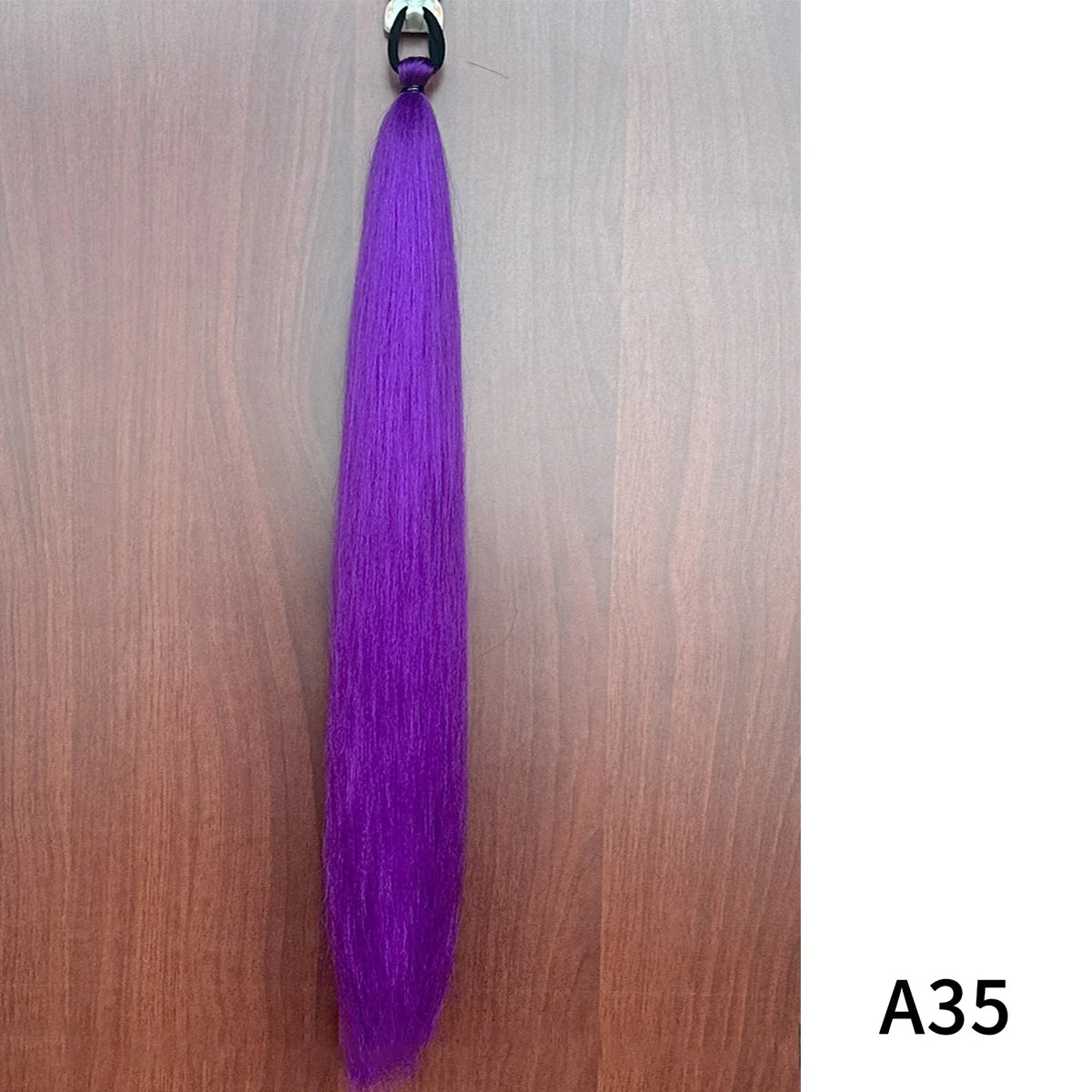 Purple synthetic ponytail extension with band, 26-28 inches long, by Corporación Turística, featuring a vibrant, natural-looking hairpiece.